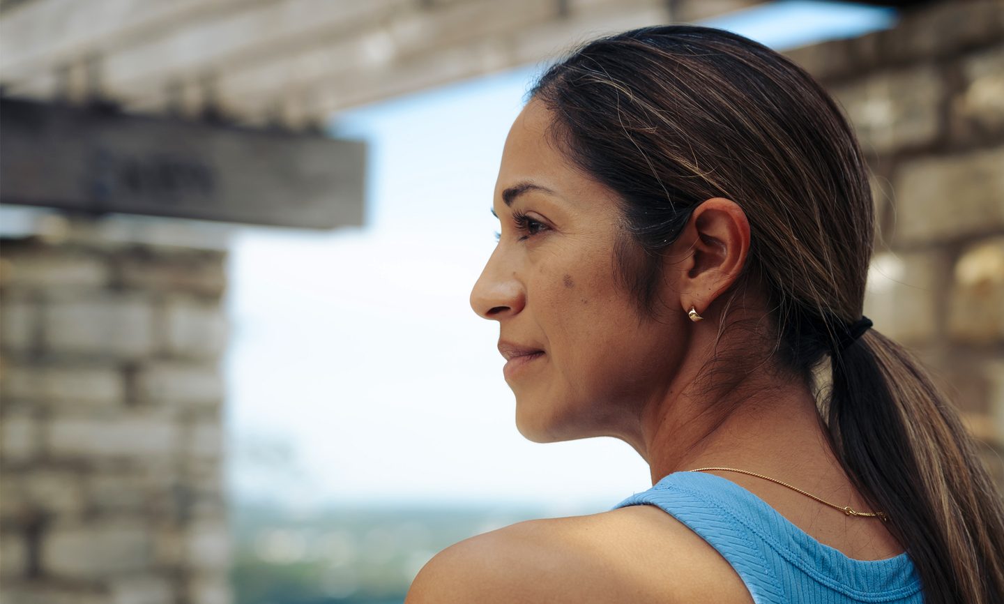The Hartford Case Study - A woman looks wistfully into the distance on her morning run.